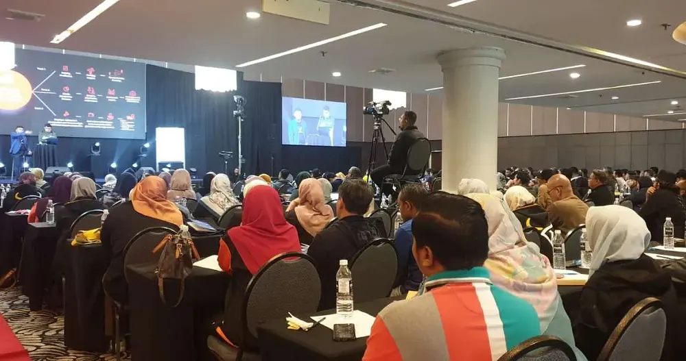 Seminar audience in a hotel ballroom