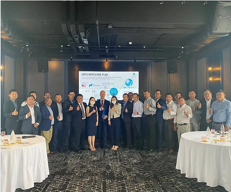 Group photograph at a capital markets implementation briefing