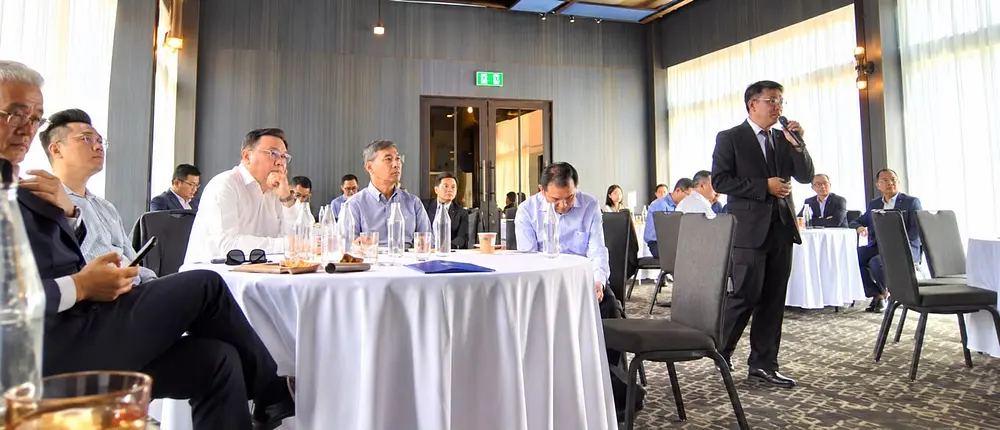 Speaking to business leaders at a roundtable